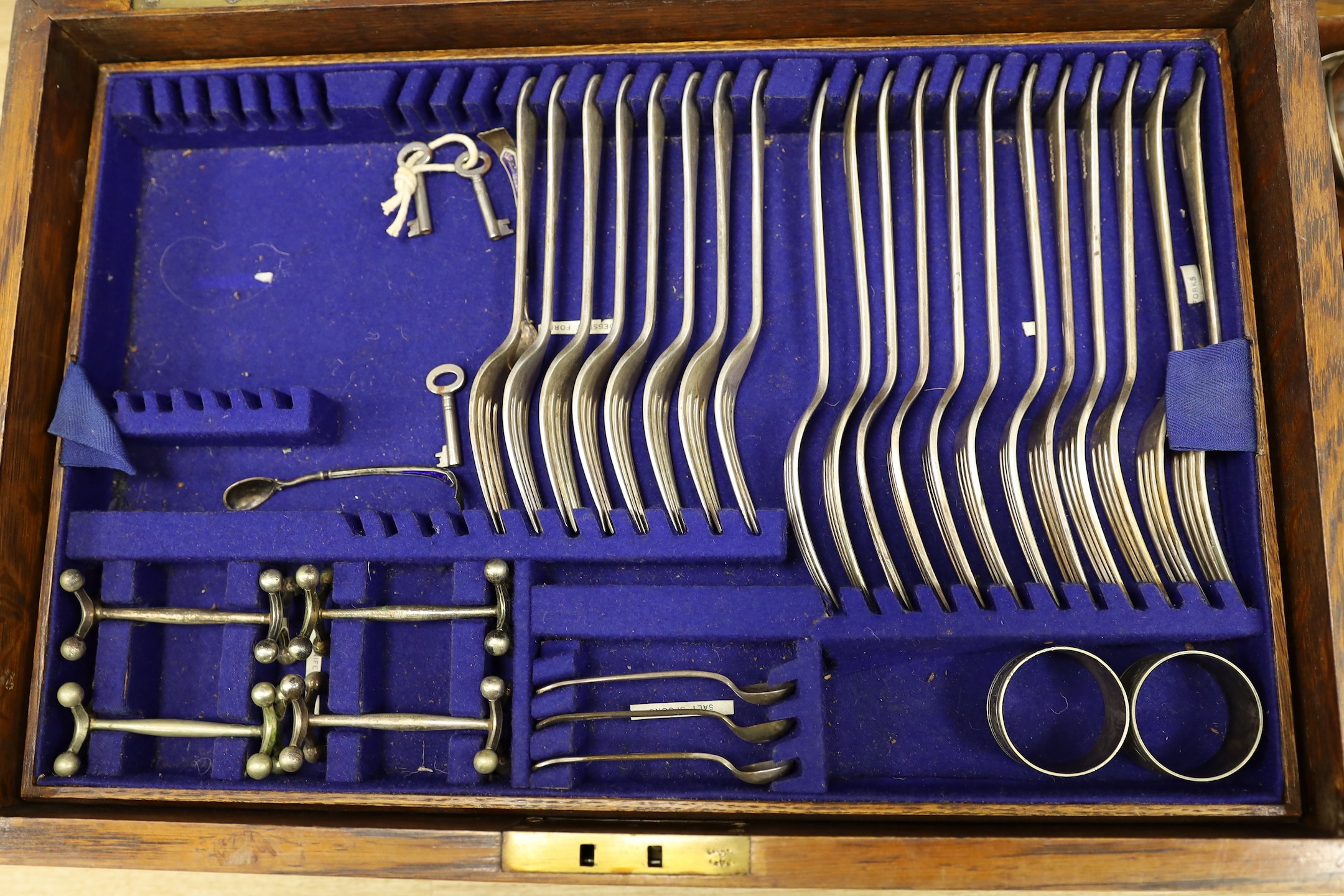 Two Mappin and Webb oak cased part cased plated canteens of cutlery